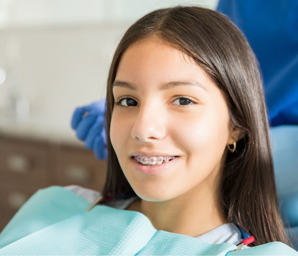 young patient smiling wearing braces